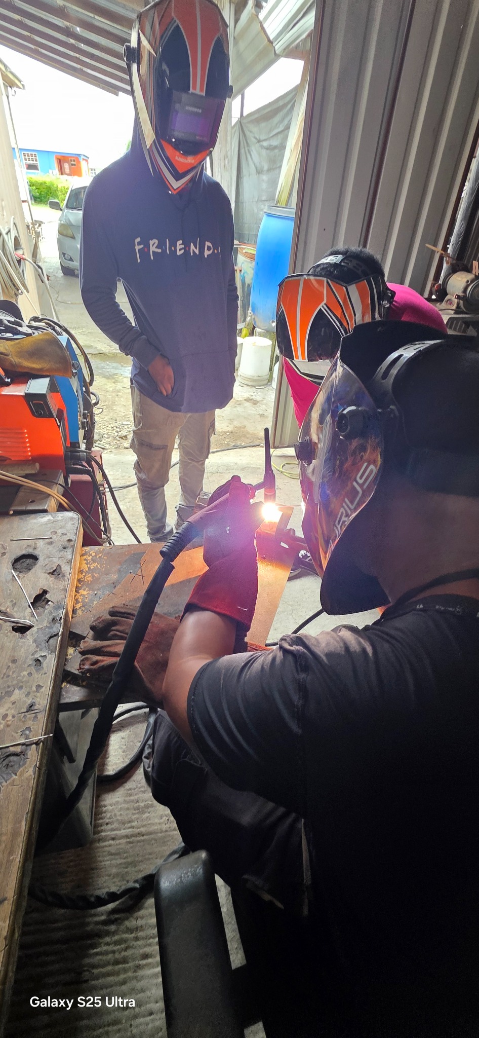 Student welding during fabrication course
