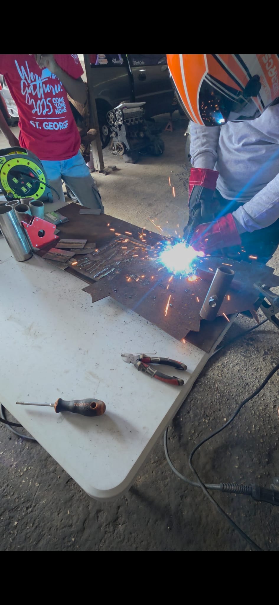 Student welding during fabrication class