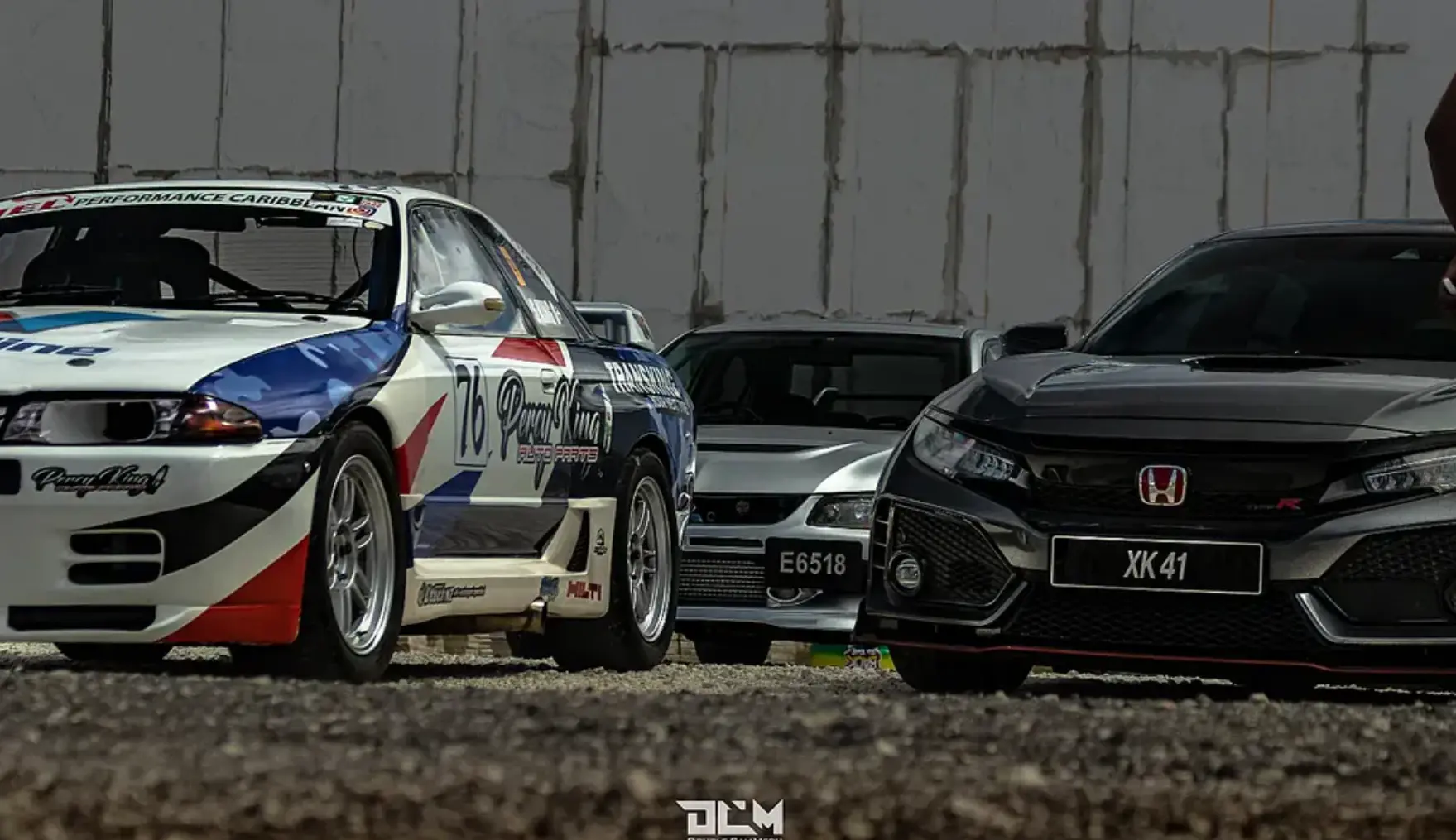 Competition cars gathered in the paddock