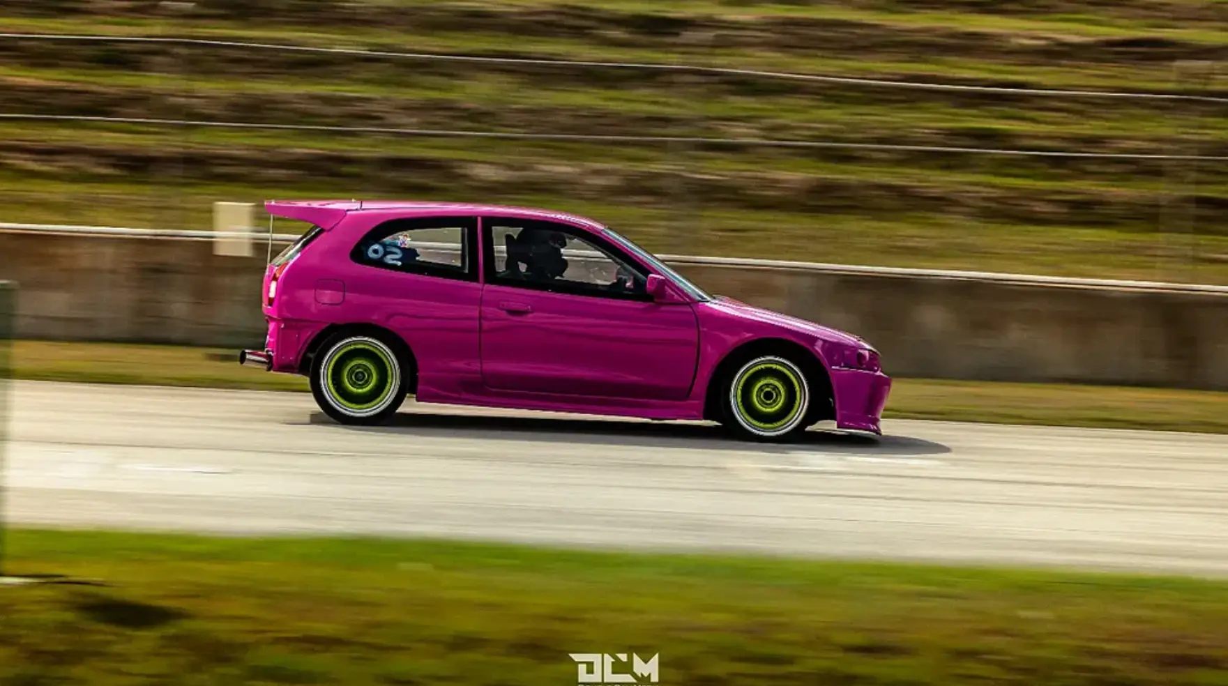Pink race car on circuit